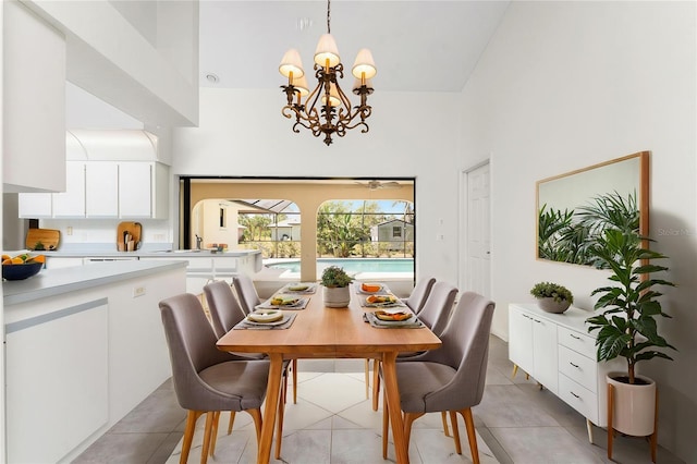 18111 Lake Worth Blvd, Port Charlotte, FL 33948 - dining space featuring a towering ceiling, a chandelier, and light tile patterned floors