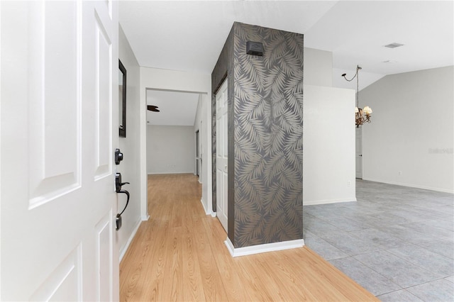 18111 Lake Worth Blvd, Port Charlotte, FL 33948 - hallway featuring a chandelier and baseboards
