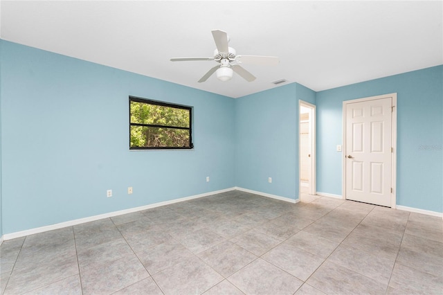 18111 Lake Worth Blvd, Port Charlotte, FL 33948 - spare room with baseboards, ceiling fan, and tile patterned flooring