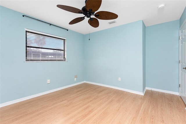 18111 Lake Worth Blvd, Port Charlotte, FL 33948 - spare room featuring light wood-style flooring, ceiling fan, and baseboards