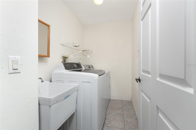 18111 Lake Worth Blvd, Port Charlotte, FL 33948 - laundry room with independent washer and dryer, baseboards, and light tile patterned flooring