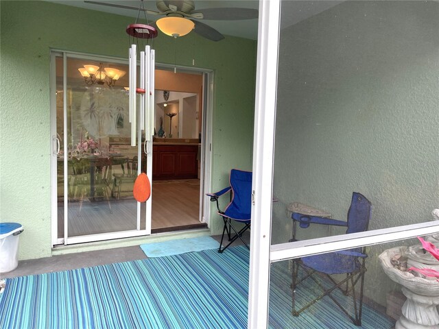13170 SW Pembroke Cir N, Lake Suzy, FL 34269 - sunroom / solarium featuring a chandelier