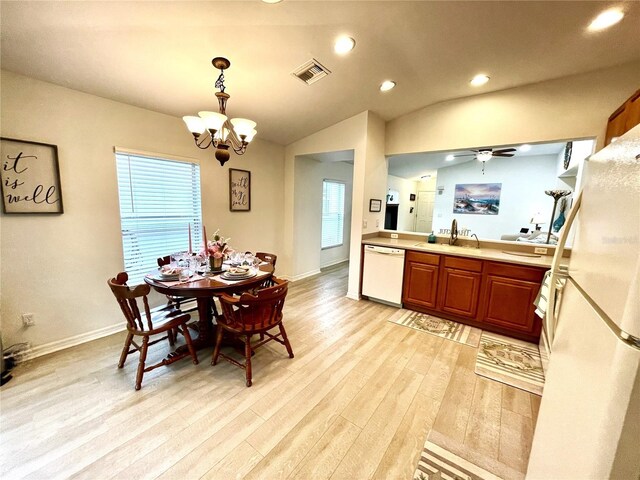 13170 SW Pembroke Cir N, Lake Suzy, FL 34269 - dining room with a chandelier, light wood-style floors, recessed lighting, baseboards, and vaulted ceiling