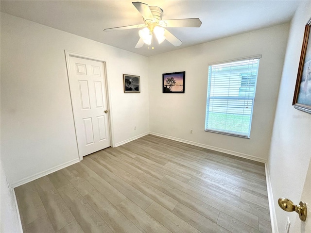 13170 SW Pembroke Cir N, Lake Suzy, FL 34269 - unfurnished room featuring wood finished floors, a ceiling fan, and baseboards