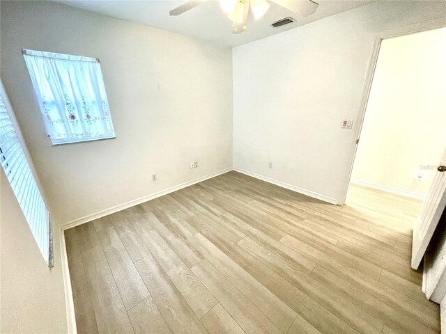 13170 SW Pembroke Cir N, Lake Suzy, FL 34269 - spare room with ceiling fan, wood finished floors, and baseboards