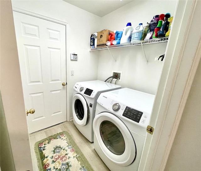 13170 SW Pembroke Cir N, Lake Suzy, FL 34269 - laundry room with independent washer and dryer and light wood finished floors