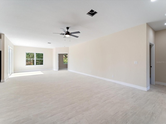 unfurnished living room with light wood-style flooring, ceiling fan, and baseboards