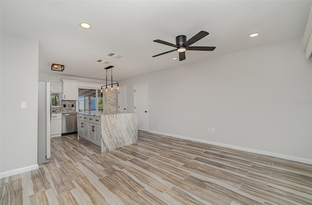 4282 Pocatella Ave, North Port, FL 34287 - kitchen with stainless steel appliances, a ceiling fan, white cabinets, recessed lighting, and decorative light fixtures