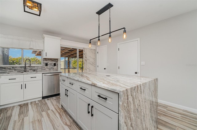 4282 Pocatella Ave, North Port, FL 34287 - kitchen featuring dishwasher, a sink, tasteful backsplash, and light stone counters