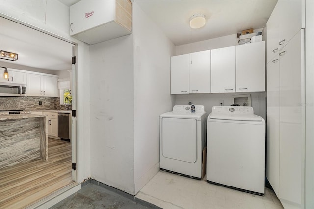 4282 Pocatella Ave, North Port, FL 34287 - laundry area with washer and dryer and cabinet space