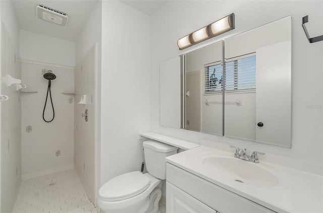 4282 Pocatella Ave, North Port, FL 34287 - full bathroom featuring a tile shower, vanity, toilet, and tile patterned flooring