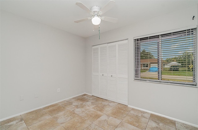 4282 Pocatella Ave, North Port, FL 34287 - unfurnished bedroom with baseboards, a closet, and ceiling fan