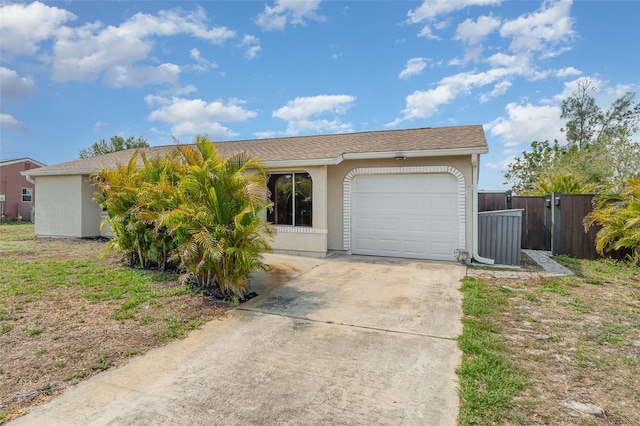 4282 Pocatella Ave, North Port, FL 34287 - view of front facade with stucco siding, an attached garage, and concrete driveway