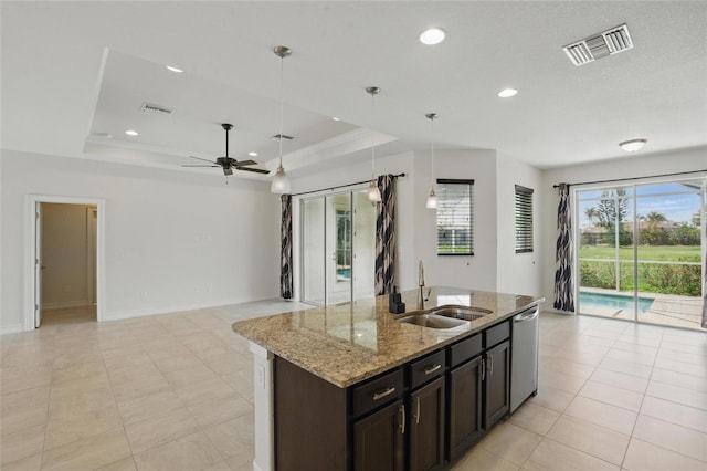 7505 Carissa, Punta Gorda, FL 33955 - kitchen featuring a sink, dishwasher, open floor plan, a ceiling fan, and a kitchen island with sink