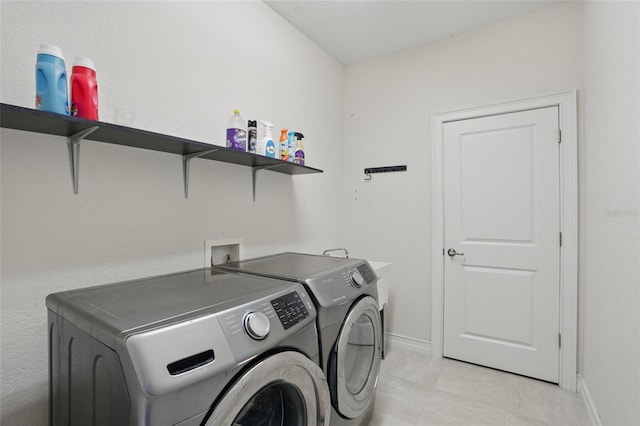 7505 Carissa, Punta Gorda, FL 33955 - laundry area featuring washer and clothes dryer and baseboards