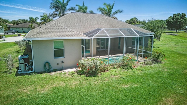 7505 Carissa, Punta Gorda, FL 33955 - rear view of house with stucco siding, a shingled roof, a yard, and an outdoor pool