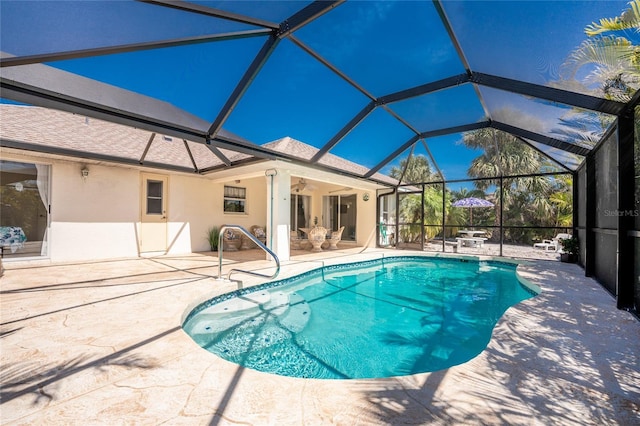 279 Mariner Ln, Rotonda West, FL 33947 - swimming pool featuring a patio, glass enclosure, and ceiling fan