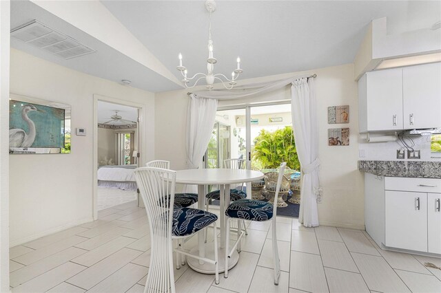 279 Mariner Ln, Rotonda West, FL 33947 - dining area featuring plenty of natural light, a chandelier, and vaulted ceiling