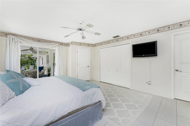 279 Mariner Ln, Rotonda West, FL 33947 - bedroom featuring access to exterior, a ceiling fan, a closet, and tile patterned flooring