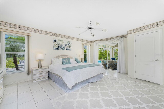 279 Mariner Ln, Rotonda West, FL 33947 - bedroom featuring access to outside, light tile patterned floors, multiple windows, and baseboards