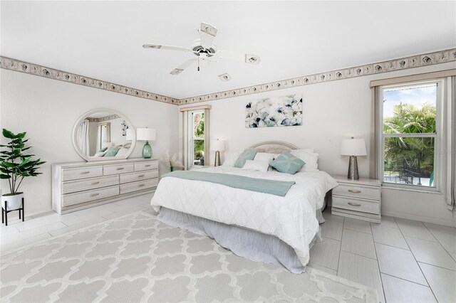 279 Mariner Ln, Rotonda West, FL 33947 - bedroom featuring multiple windows, ceiling fan, tile patterned flooring, and baseboards