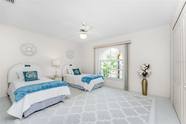 279 Mariner Ln, Rotonda West, FL 33947 - bedroom with a closet, baseboards, and a ceiling fan