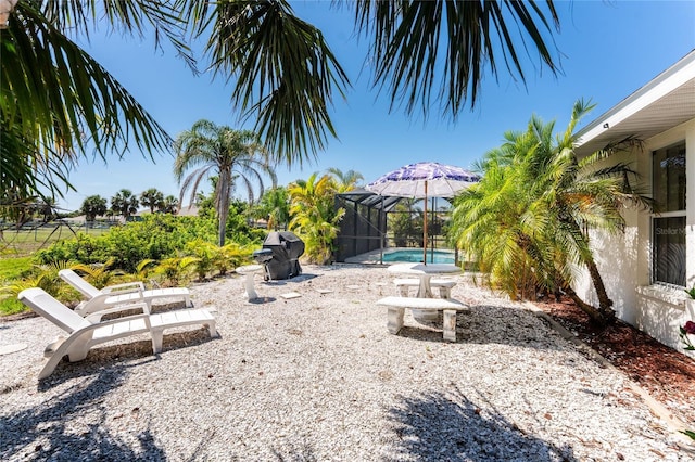 279 Mariner Ln, Rotonda West, FL 33947 - view of yard with an outdoor pool, a lanai, and a patio