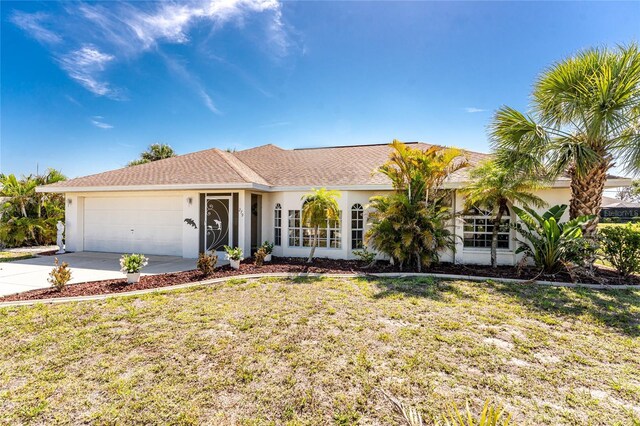 279 Mariner Ln, Rotonda West, FL 33947 - ranch-style house with a garage, driveway, stucco siding, and a front lawn