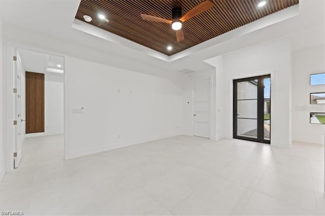 731 Colyer St E, Lehigh Acres, FL 33974 - spare room featuring a raised ceiling, ceiling fan, recessed lighting, and baseboards
