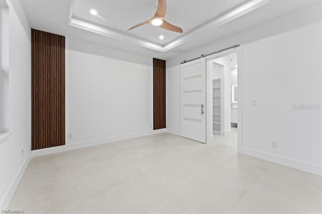 731 Colyer St E, Lehigh Acres, FL 33974 - unfurnished bedroom featuring recessed lighting, a tray ceiling, ceiling fan, and baseboards