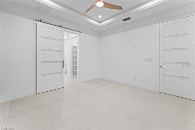 731 Colyer St E, Lehigh Acres, FL 33974 - empty room featuring ceiling fan, a raised ceiling, baseboards, and ornamental molding