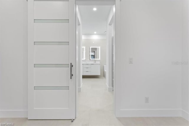 731 Colyer St E, Lehigh Acres, FL 33974 - hallway with light tile patterned flooring and recessed lighting