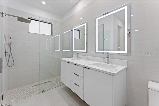 731 Colyer St E, Lehigh Acres, FL 33974 - bathroom featuring a stall shower, double vanity, toilet, and tile walls