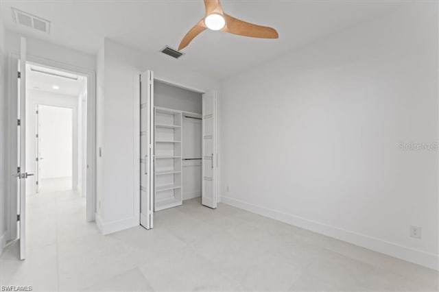 731 Colyer St E, Lehigh Acres, FL 33974 - unfurnished bedroom featuring baseboards, a closet, and ceiling fan