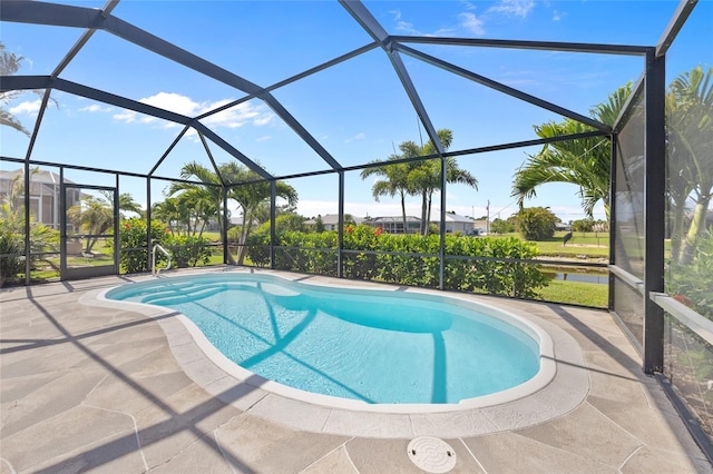 outdoor pool with a patio and a lanai
