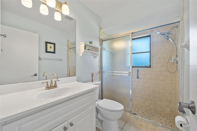 full bathroom with a shower stall, vanity, toilet, and tile patterned flooring