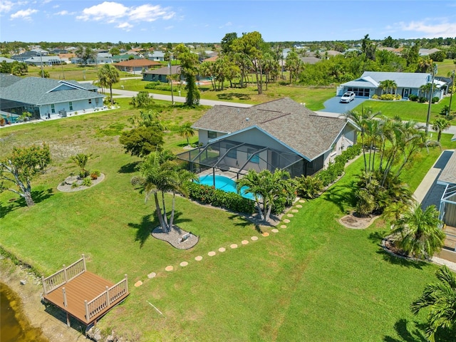 aerial perspective of suburban area featuring a pool