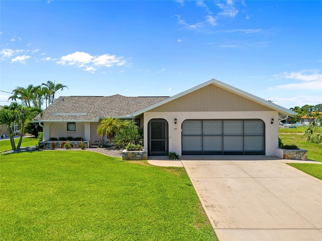 ranch-style house featuring a garage, a front yard, concrete driveway, and roof with shingles