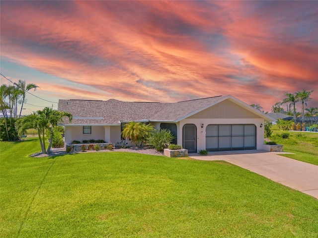 69 Bunker Rd, Rotonda West, FL 33947 - ranch-style house featuring a front yard, a garage, and concrete driveway