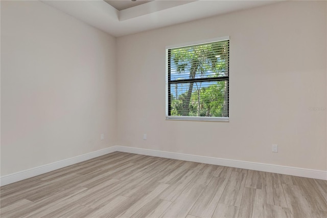 unfurnished room featuring light wood-style floors and baseboards