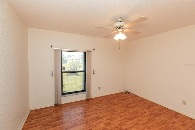 1612 Blue Lake Cir, Punta Gorda, FL 33983 - unfurnished room featuring light wood finished floors, a ceiling fan, and a textured ceiling