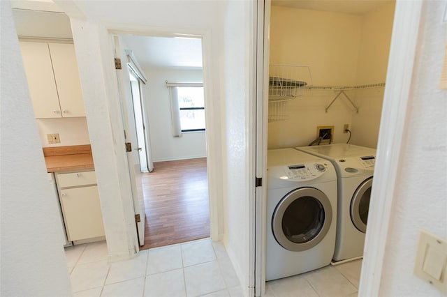 1612 Blue Lake Cir, Punta Gorda, FL 33983 - washroom with washing machine and clothes dryer and light tile patterned floors