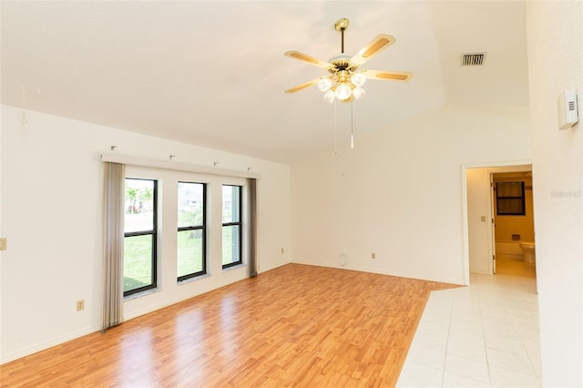 1612 Blue Lake Cir, Punta Gorda, FL 33983 - spare room featuring ceiling fan, light wood-type flooring, and vaulted ceiling