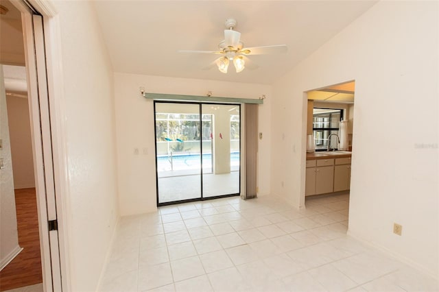 1612 Blue Lake Cir, Punta Gorda, FL 33983 - spare room with ceiling fan, lofted ceiling, and light tile patterned flooring
