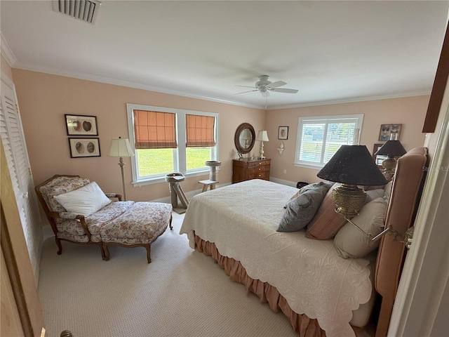 1005 S Sands Paradise Pt, Inverness, FL 34450 - bedroom with crown molding, a ceiling fan, baseboards, and light carpet