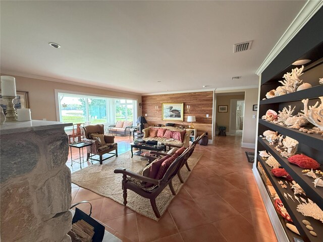 1005 S Sands Paradise Pt, Inverness, FL 34450 - living area with wooden walls, ornamental molding, tile patterned flooring, and baseboards