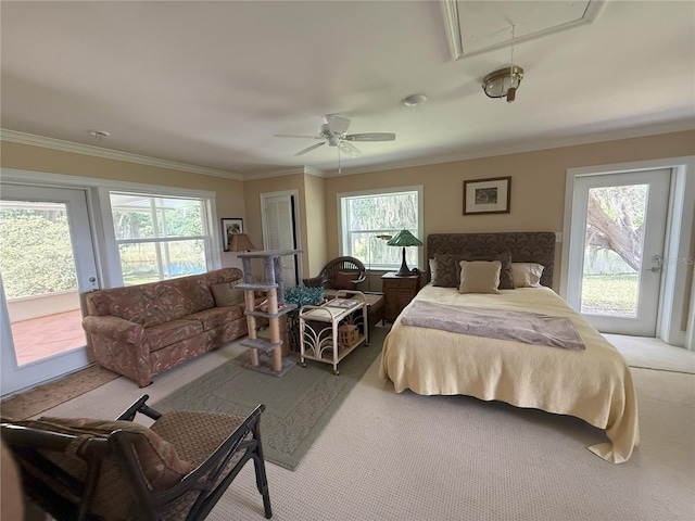 1005 S Sands Paradise Pt, Inverness, FL 34450 - bedroom featuring access to exterior, attic access, carpet floors, multiple windows, and crown molding