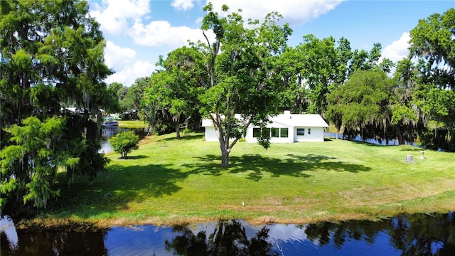 1005 S Sands Paradise Pt, Inverness, FL 34450 - view of green lawn featuring a water view