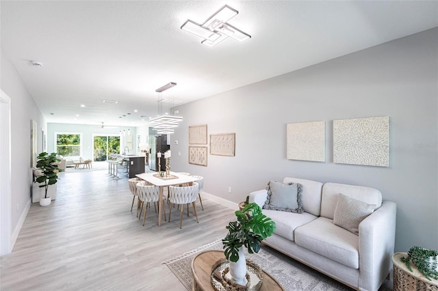 19160 Ruskin Ave, Port Charlotte, FL 33954 - living room featuring light wood-style flooring and baseboards