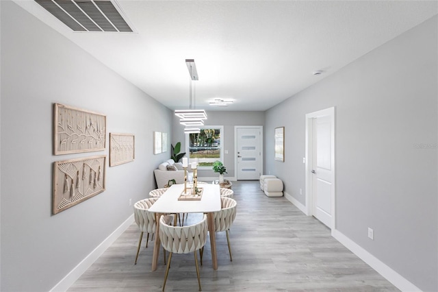 19160 Ruskin Ave, Port Charlotte, FL 33954 - dining space with baseboards and light wood-type flooring